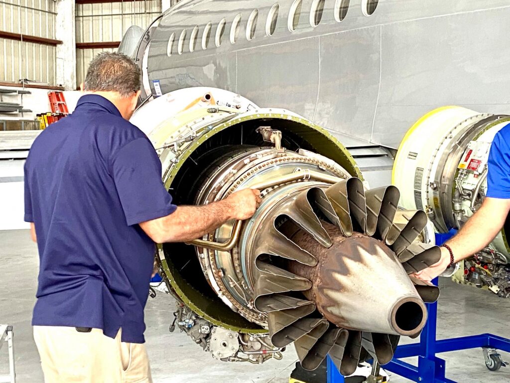 Mechanic working on jet engine
